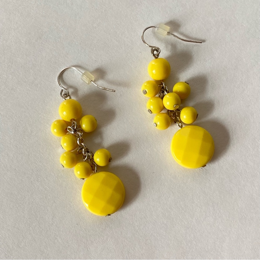Yellow plastic faceted and round beaded earrings